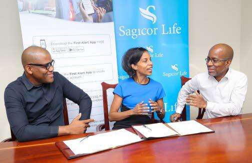 Vice-president, Employee Benefits Division, Nicola Leo-Rhynie (centre), and executive vice-presidentof the Employee Benefits Division, Sagicor Life, Willard Brown (right), engages managing partner, FirstResponder's Technology Limited, Aldain Reid, in conversation during a recent signing ceremony atSagicor Life's head office in New Kingston.